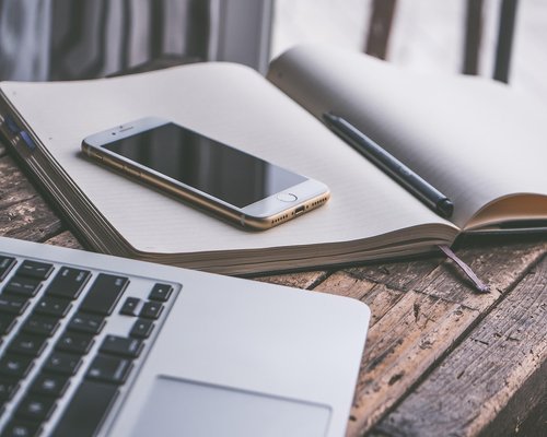 A notebook and pen on a modern desk in Las Condes, Santiago